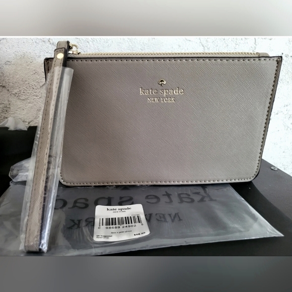 kate spade Handbags - Kate Spade Gray Wristlet Clutch